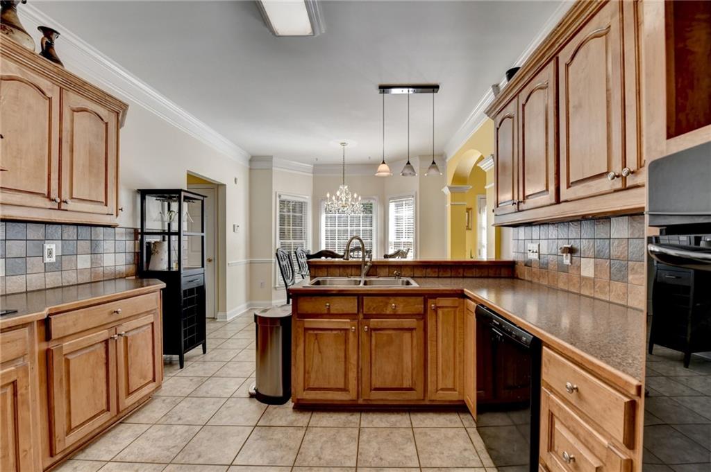 1031 Riverside Road Sugar Hill, GA 30518 - Photo 29 of 109 a kitchen with stainless steel appliances granite countertop a sink and cabinets