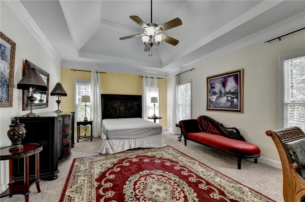 1031 Riverside Road Sugar Hill, GA 30518 - Photo 7 of 109 a living room with furniture and a flat screen tv