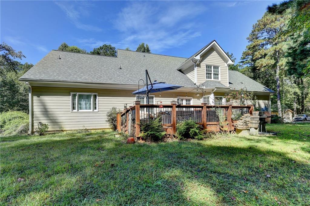 1031 Riverside Road Sugar Hill, GA 30518 - Photo 88 of 109 a front view of a house with a yard