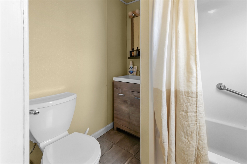146 Hunter Street Fall River, MA 02721 - Photo 11 of 41 a bathroom with a toilet and a shower