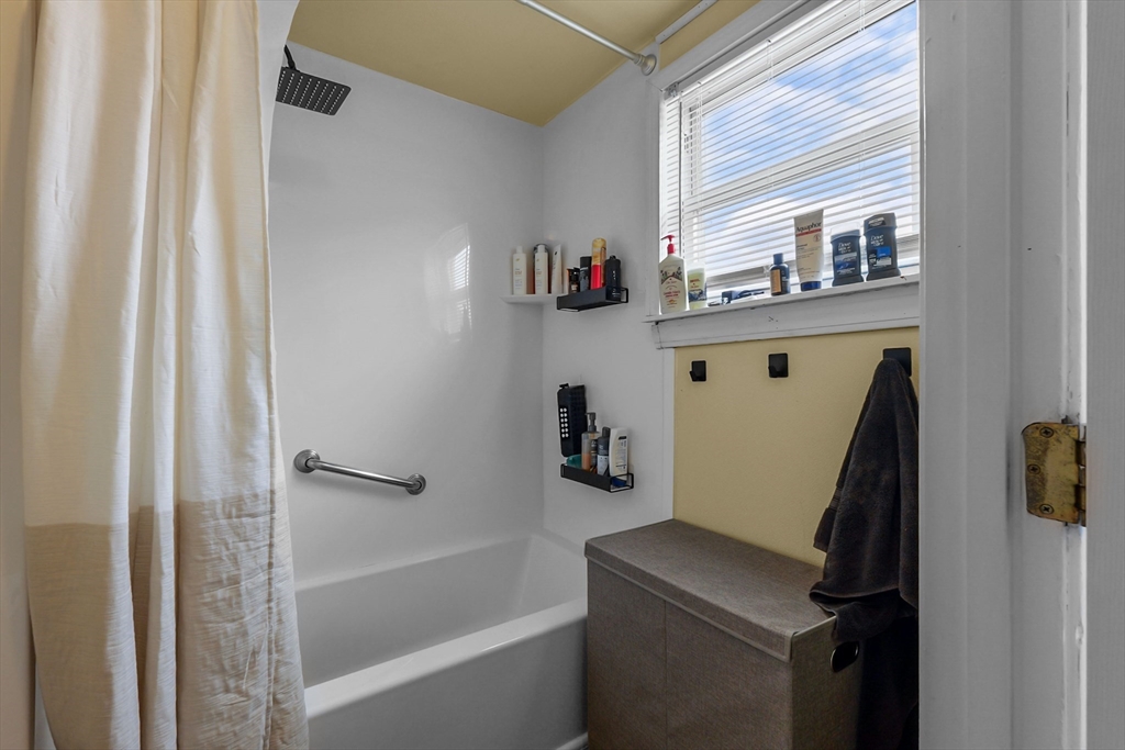 146 Hunter Street Fall River, MA 02721 - Photo 12 of 41 a bathroom with a sink and a bathtub