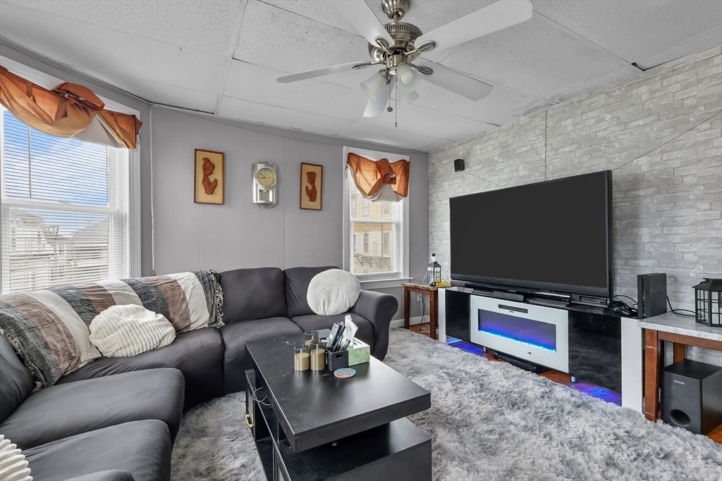 146 Hunter Street Fall River, MA 02721 - Photo 13 of 41 a living room with furniture and a flat screen tv