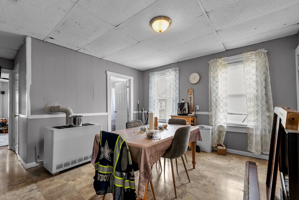 146 Hunter Street Fall River, MA 02721 - Photo 20 of 41 a view of a dining room with furniture and a chandelier