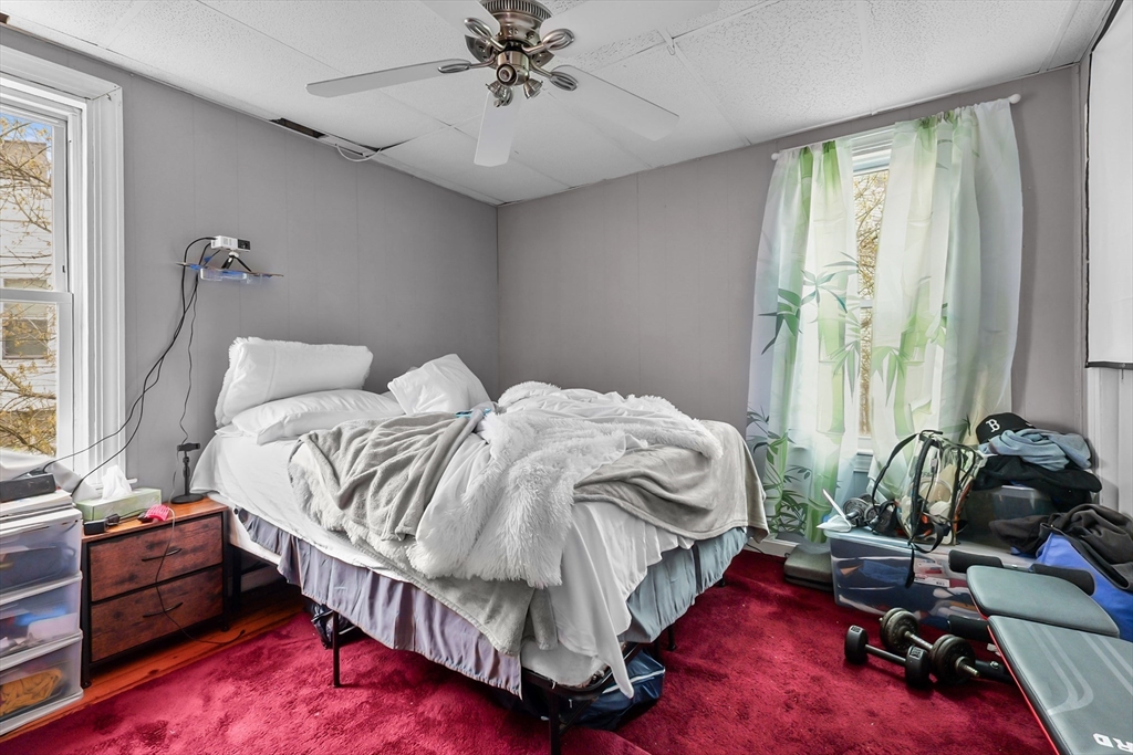 146 Hunter Street Fall River, MA 02721 - Photo 23 of 41 a bed sitting in a bedroom next to a window