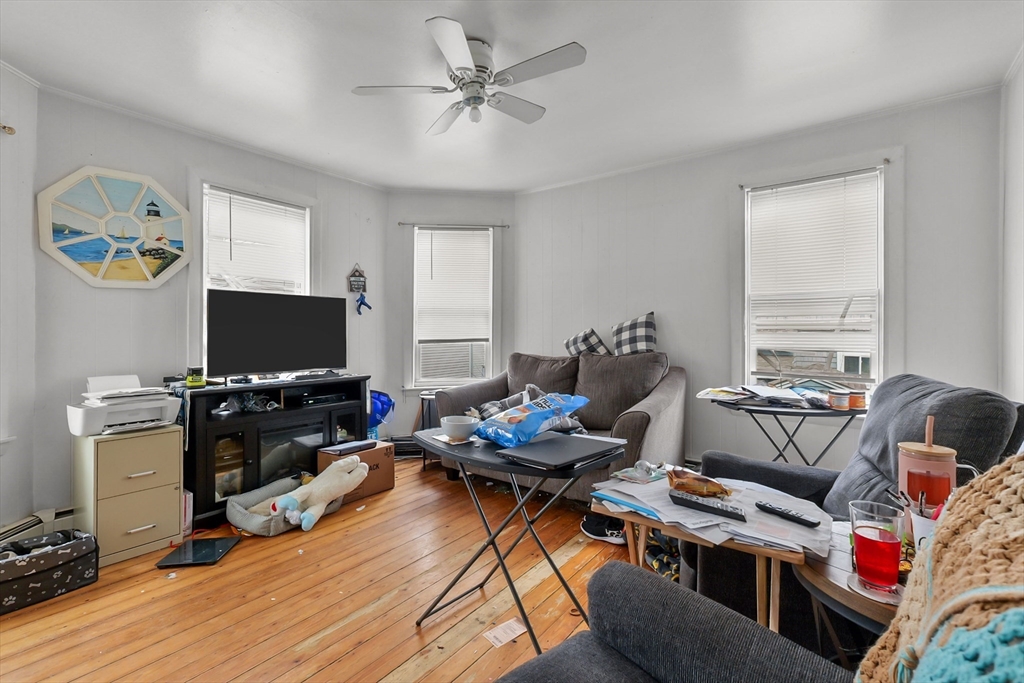 146 Hunter Street Fall River, MA 02721 - Photo 28 of 41 a living room with furniture and a flat screen tv