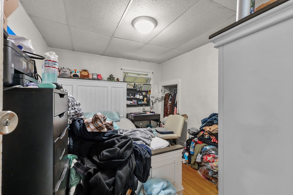 146 Hunter Street Fall River, MA 02721 - Photo 34 of 41 a bed room with a bed and a couch