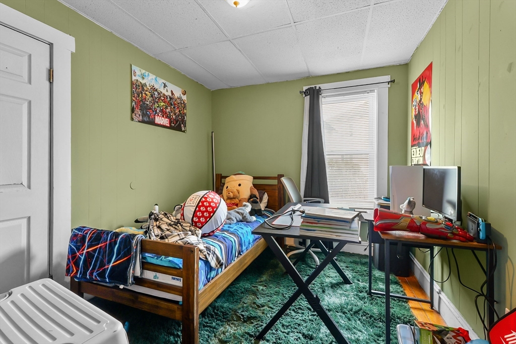 146 Hunter Street Fall River, MA 02721 - Photo 5 of 41 a bedroom with furniture and a window
