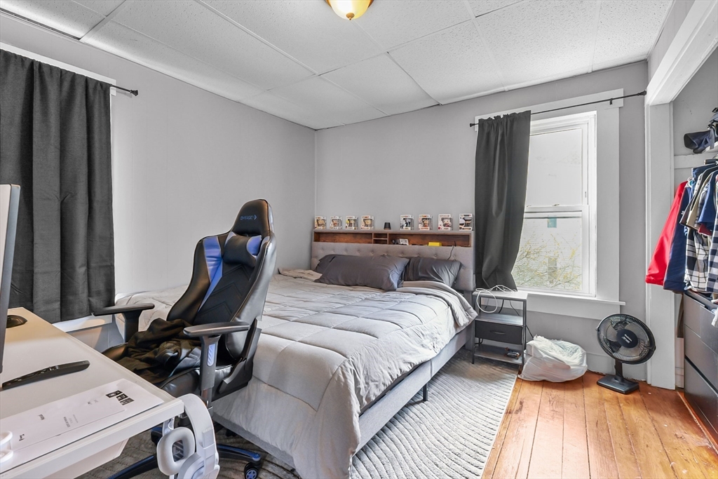 146 Hunter Street Fall River, MA 02721 - Photo 6 of 41 a bedroom with a bed and a desk