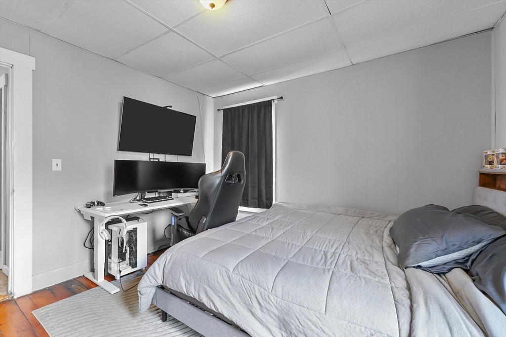 146 Hunter Street Fall River, MA 02721 - Photo 7 of 41 a bedroom with a bed and flat screen tv