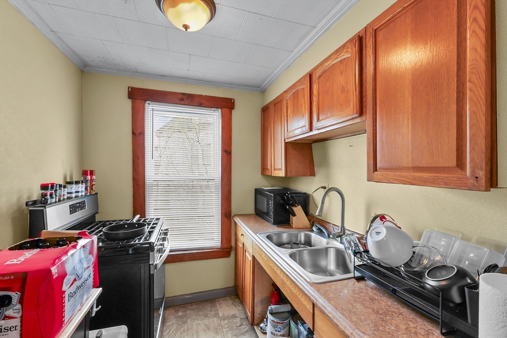 146 Hunter Street Fall River, MA 02721 - Photo 8 of 41 a kitchen with a stove and a sink