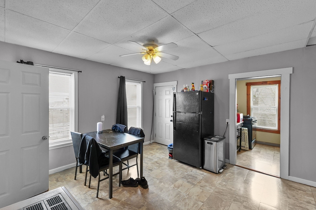 146 Hunter Street Fall River, MA 02721 - Photo 10 of 41 a kitchen with stainless steel appliances granite countertop a refrigerator and a stove top oven