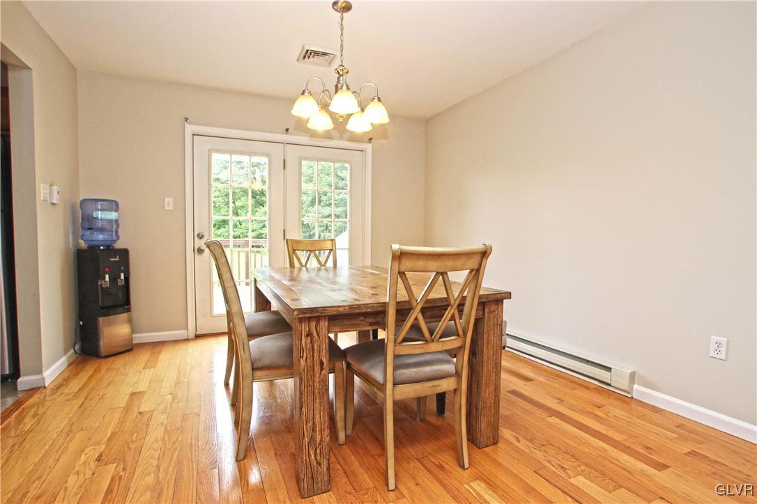 508 Weir Mountain Road Gilbert, PA 18331 - Photo 11 of 37 a view of a dining room with furniture window and wooden floor