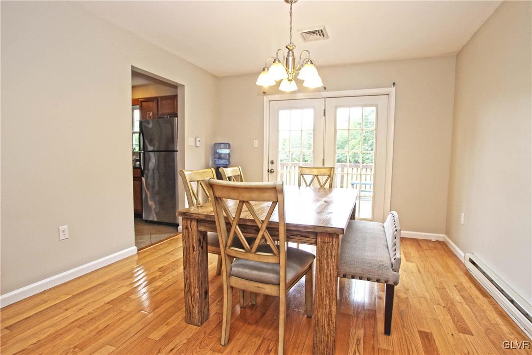 508 Weir Mountain Road Gilbert, PA 18331 - Photo 12 of 37 a view of a dining room with furniture window and wooden floor