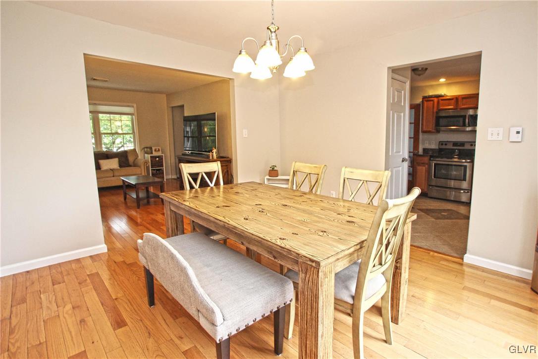 508 Weir Mountain Road Gilbert, PA 18331 - Photo 13 of 37 a view of a dining room with furniture and wooden floor