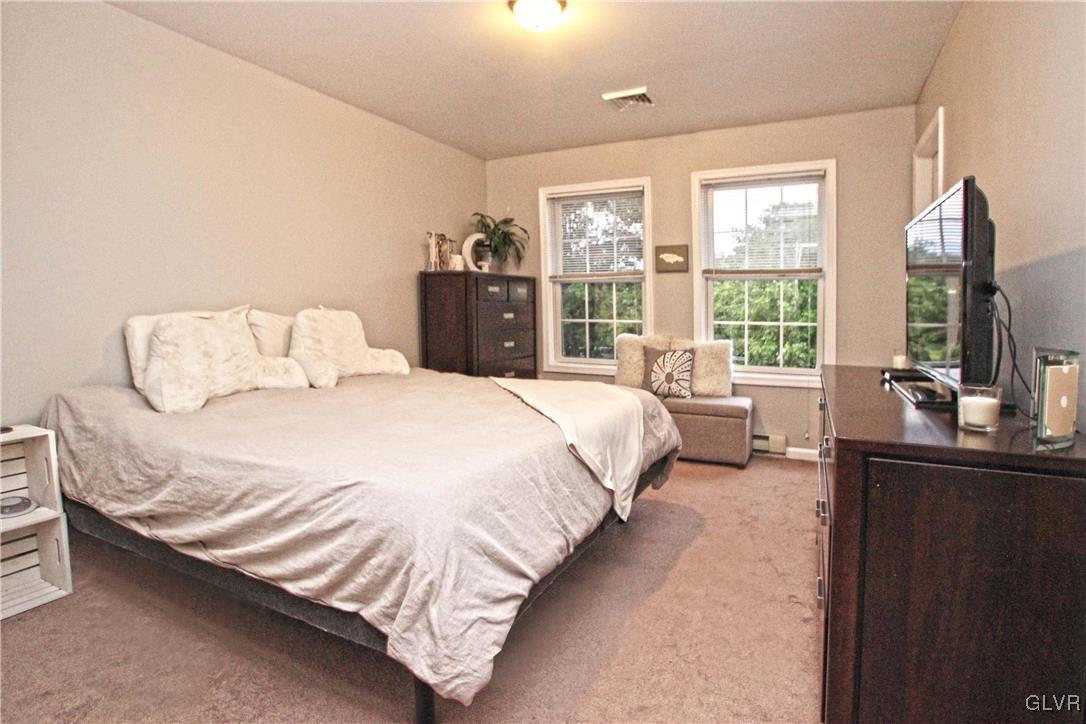 508 Weir Mountain Road Gilbert, PA 18331 - Photo 18 of 37 a bedroom with a bed and a large window