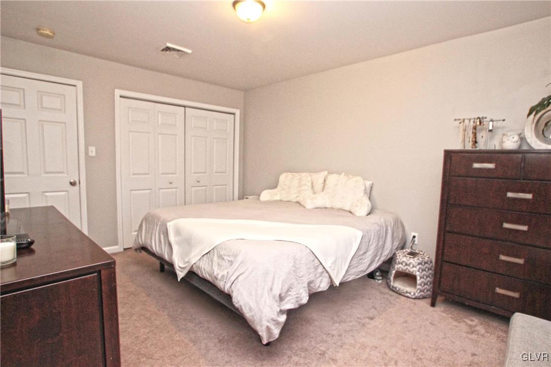 508 Weir Mountain Road Gilbert, PA 18331 - Photo 19 of 37 a bedroom with a bed and a dresser