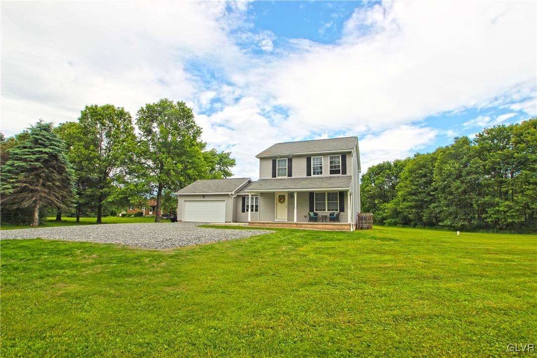 508 Weir Mountain Road Gilbert, PA 18331 - Photo 33 of 37 a view of a house with a big yard and large trees
