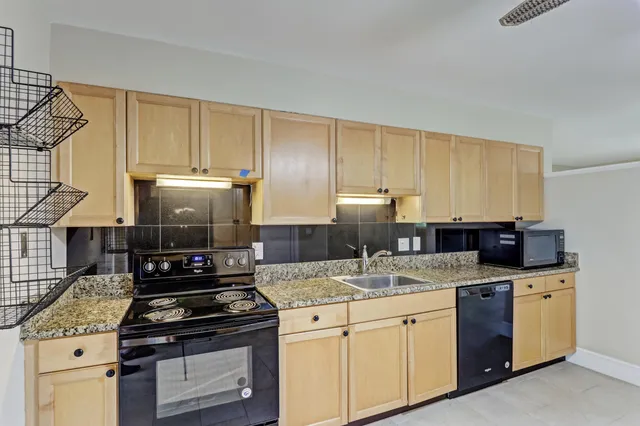 a kitchen with a stove and a sink