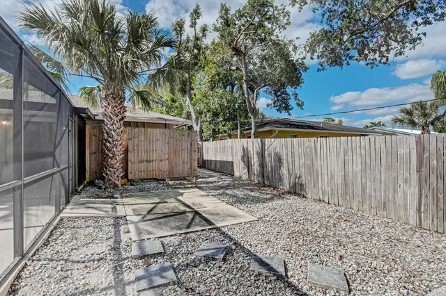 a backyard of a house with lots of green space