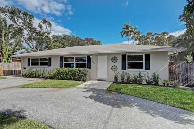 front view of a house and a yard