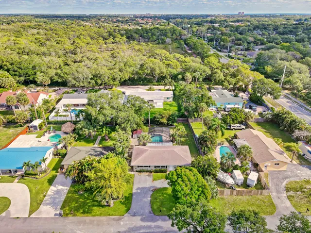 an aerial view of residential houses with outdoor space