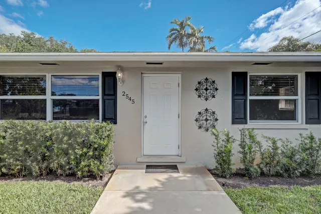 front view of a house with a small yard