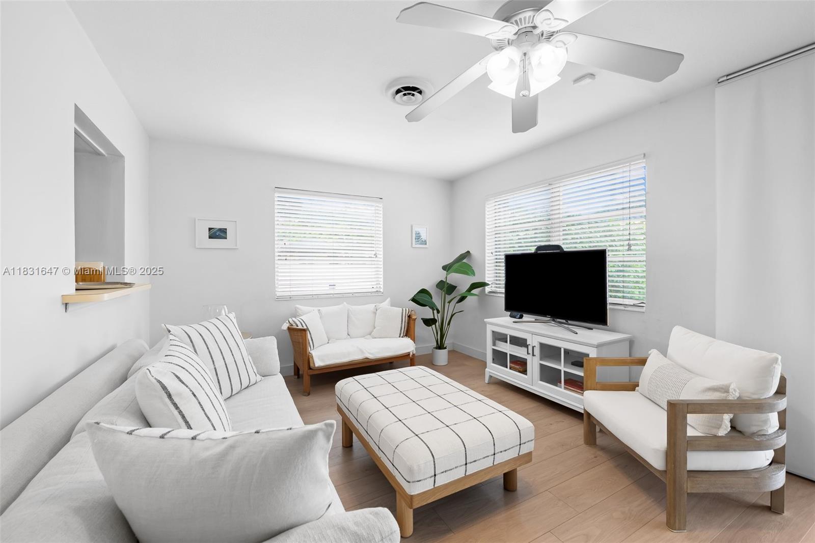 2015 North 37th Avenue Hollywood, FL 33021 - Photo 7 of 16 a living room with furniture and a flat screen tv