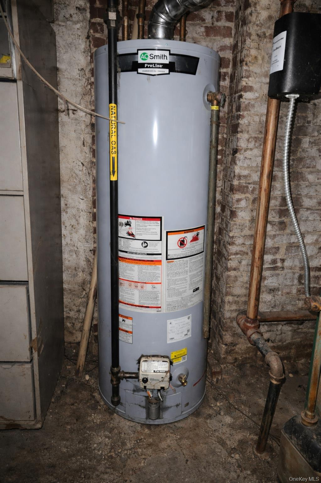 91-45 85th Street Queens, NY 11421 - Photo 13 of 15 a close view of water heater room