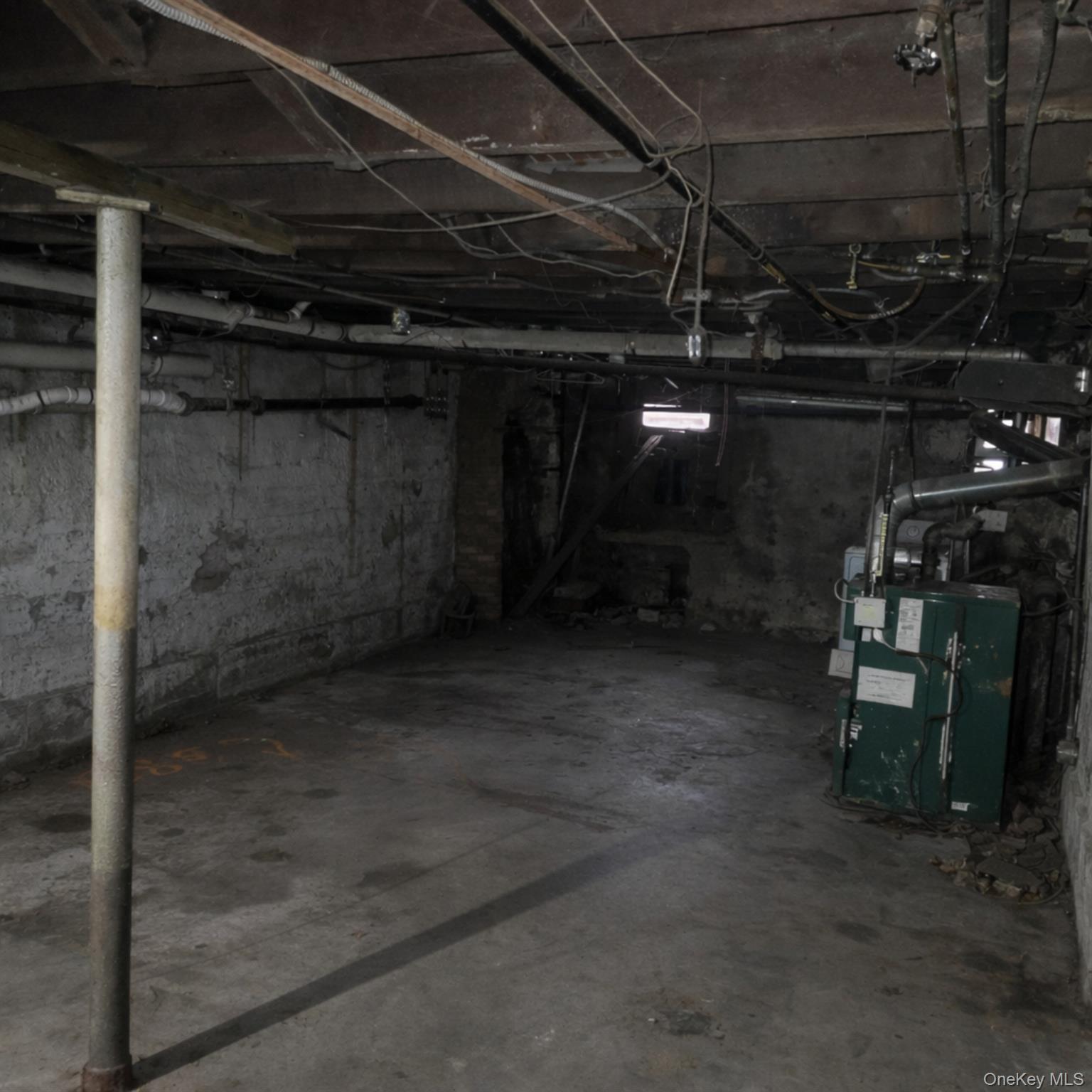91-45 85th Street Queens, NY 11421 - Photo 14 of 15 a view of a room with wooden walls