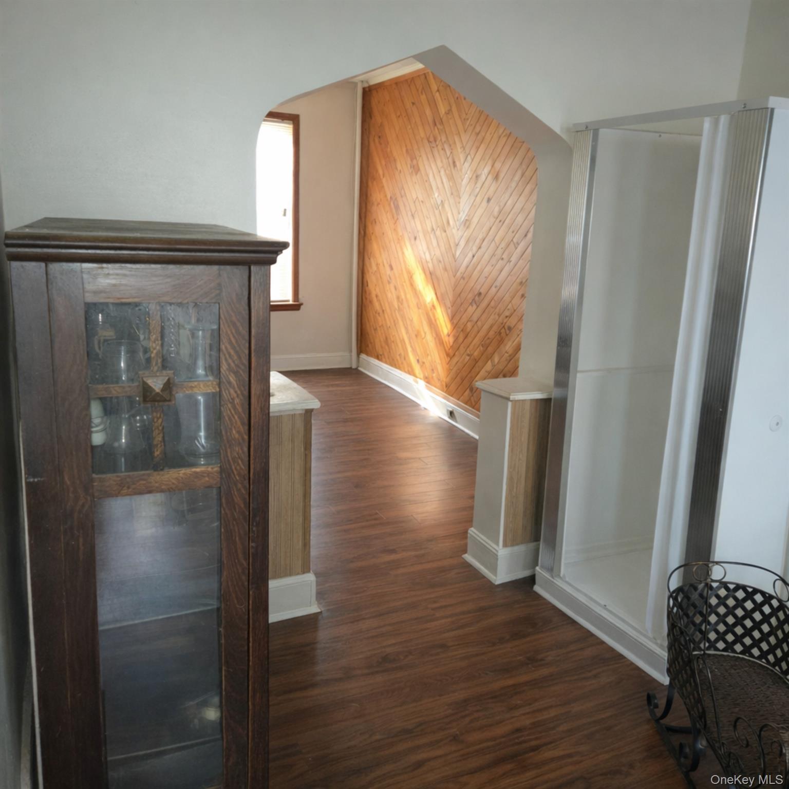 91-45 85th Street Queens, NY 11421 - Photo 6 of 15 a view of empty room with wooden floor and fan