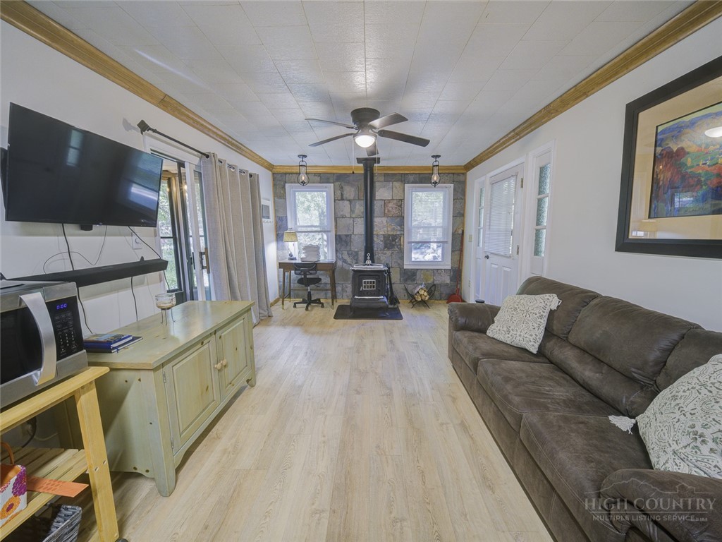 1471 Bamboo Road Boone, NC 28607 - Photo 8 of 19 a living room with furniture and a flat screen tv