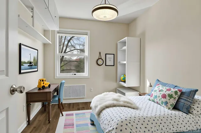 a bedroom with bed and a window