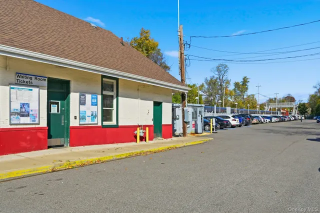 a picture of a room with a white wall and a picture
