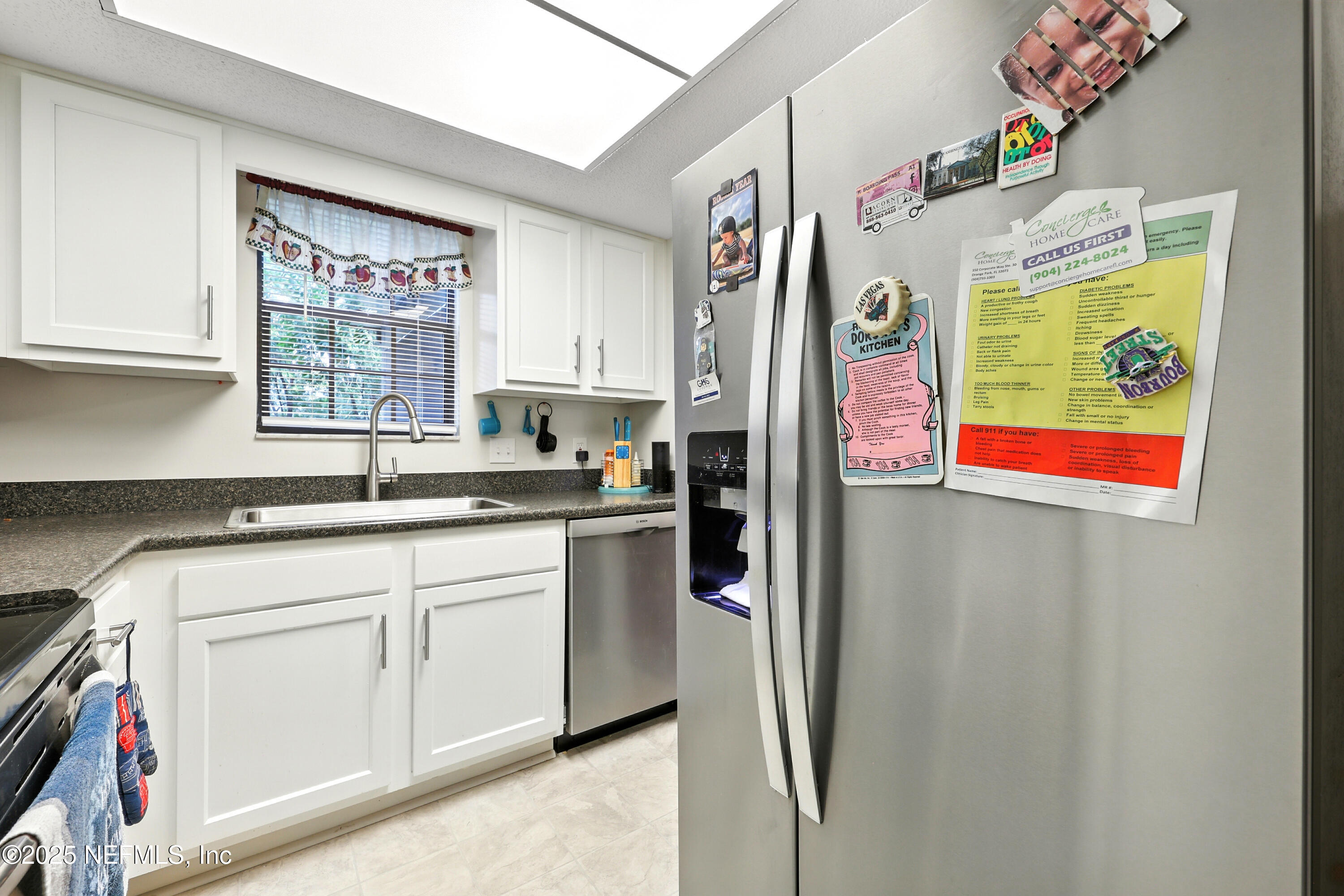 504 Kettering Way Orange Park, FL 32073 - Photo 11 of 27 a kitchen with stainless steel appliances granite countertop a refrigerator and a sink
