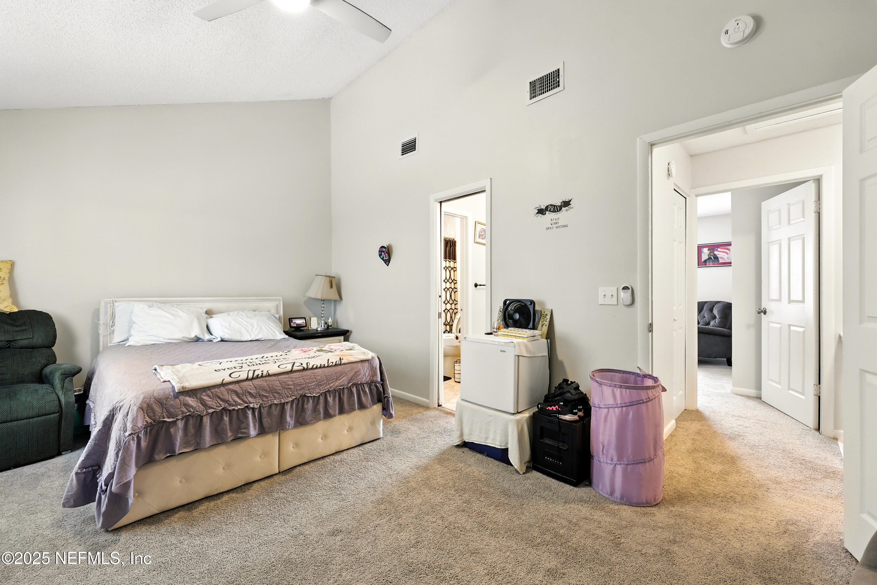 504 Kettering Way Orange Park, FL 32073 - Photo 16 of 27 a bedroom with a bed and a table