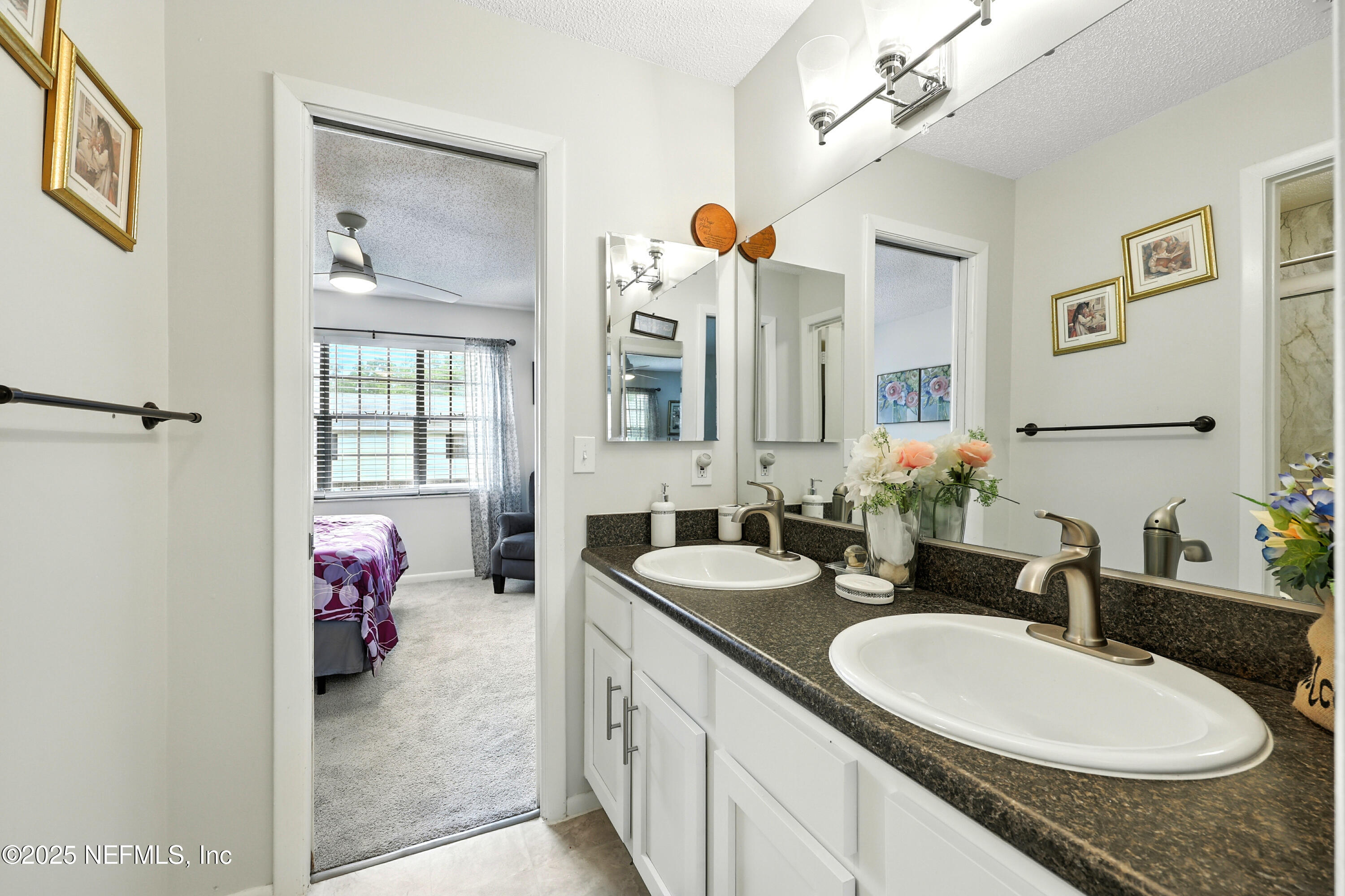 504 Kettering Way Orange Park, FL 32073 - Photo 19 of 27 a en suite bathroom with a double vanity sink and a mirror