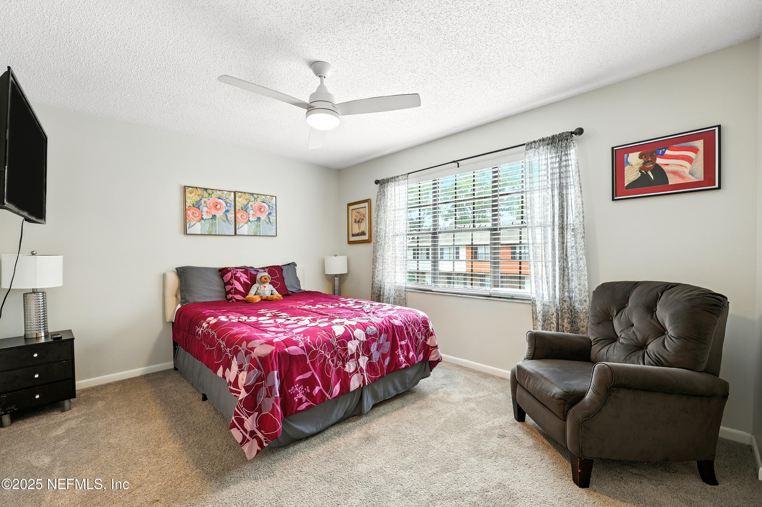 504 Kettering Way Orange Park, FL 32073 - Photo 21 of 27 a bedroom with a bed couch and window