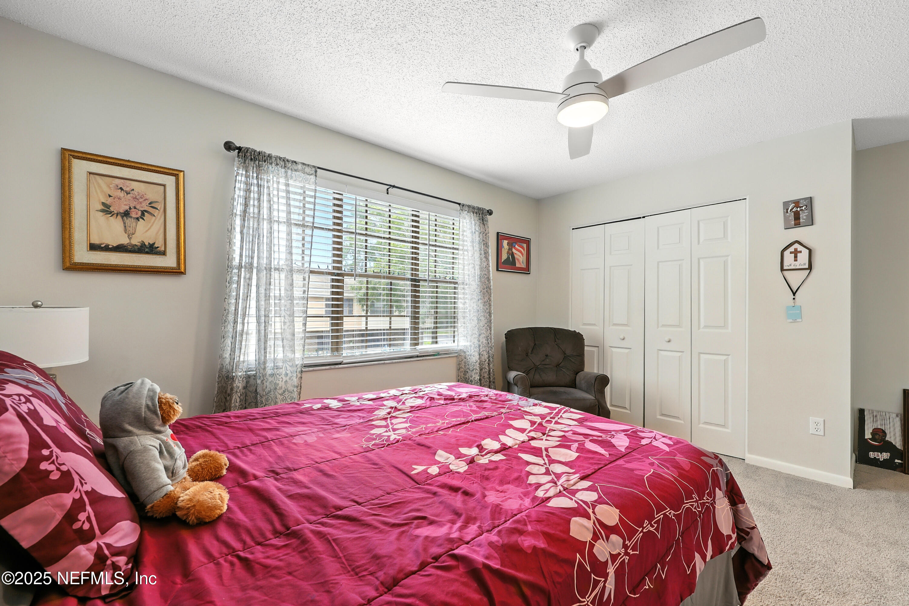 504 Kettering Way Orange Park, FL 32073 - Photo 22 of 27 a bedroom with a large bed and a window