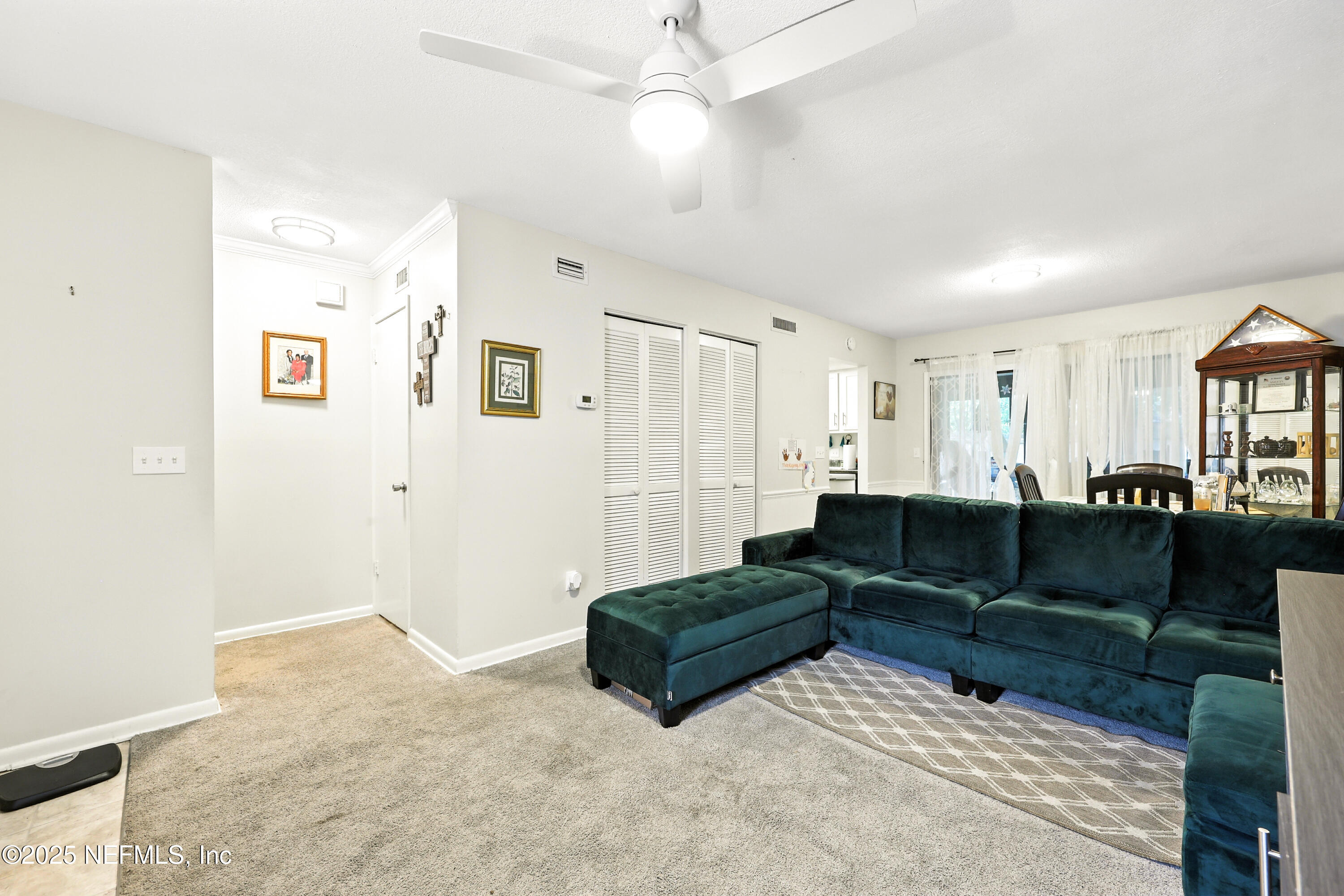 504 Kettering Way Orange Park, FL 32073 - Photo 4 of 27 a living room with couch and a view of kitchen
