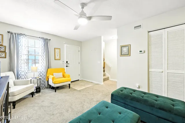 a living room with furniture and a window