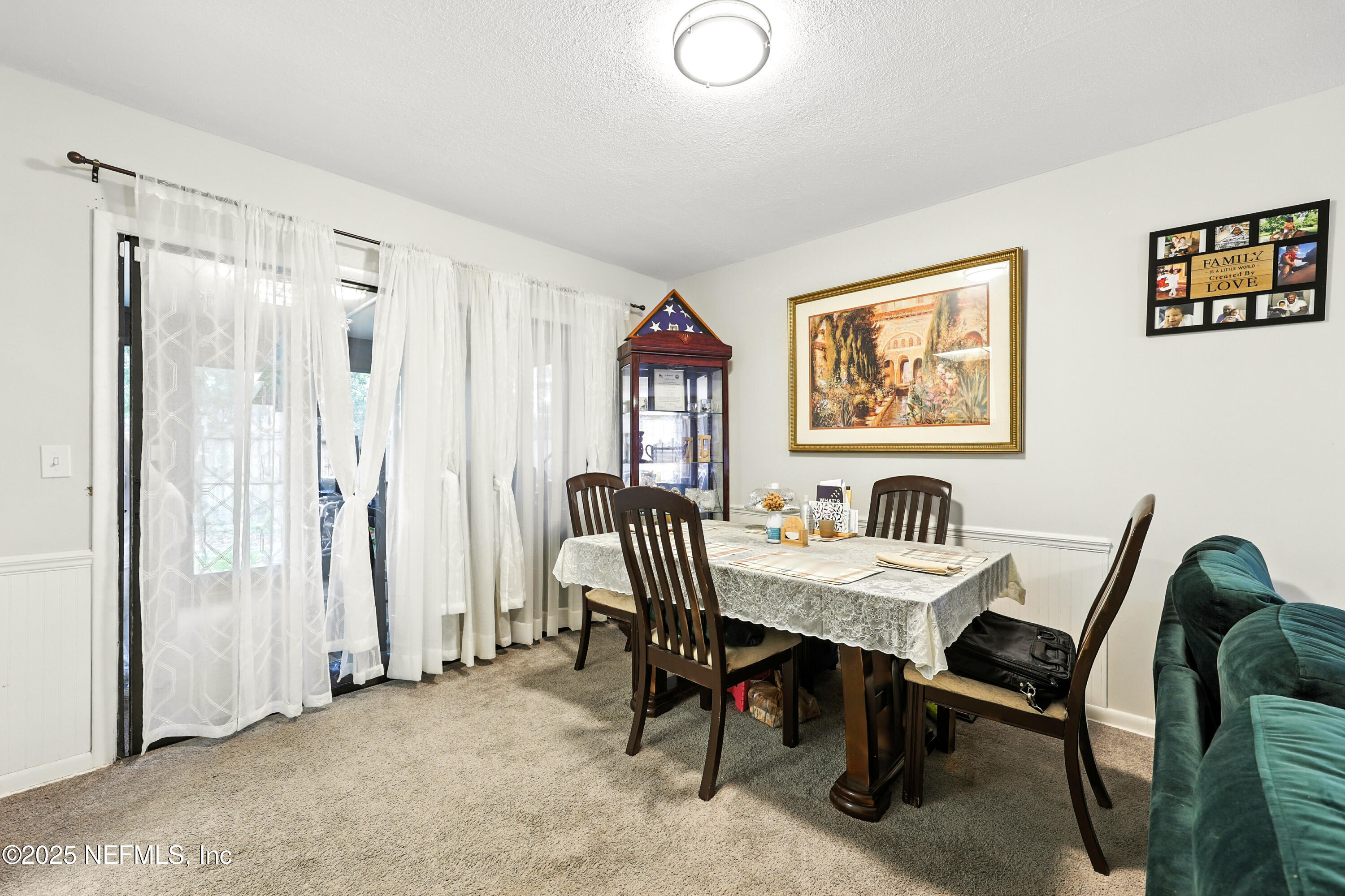 504 Kettering Way Orange Park, FL 32073 - Photo 6 of 27 a view of a a dining room with furniture window and wooden floor