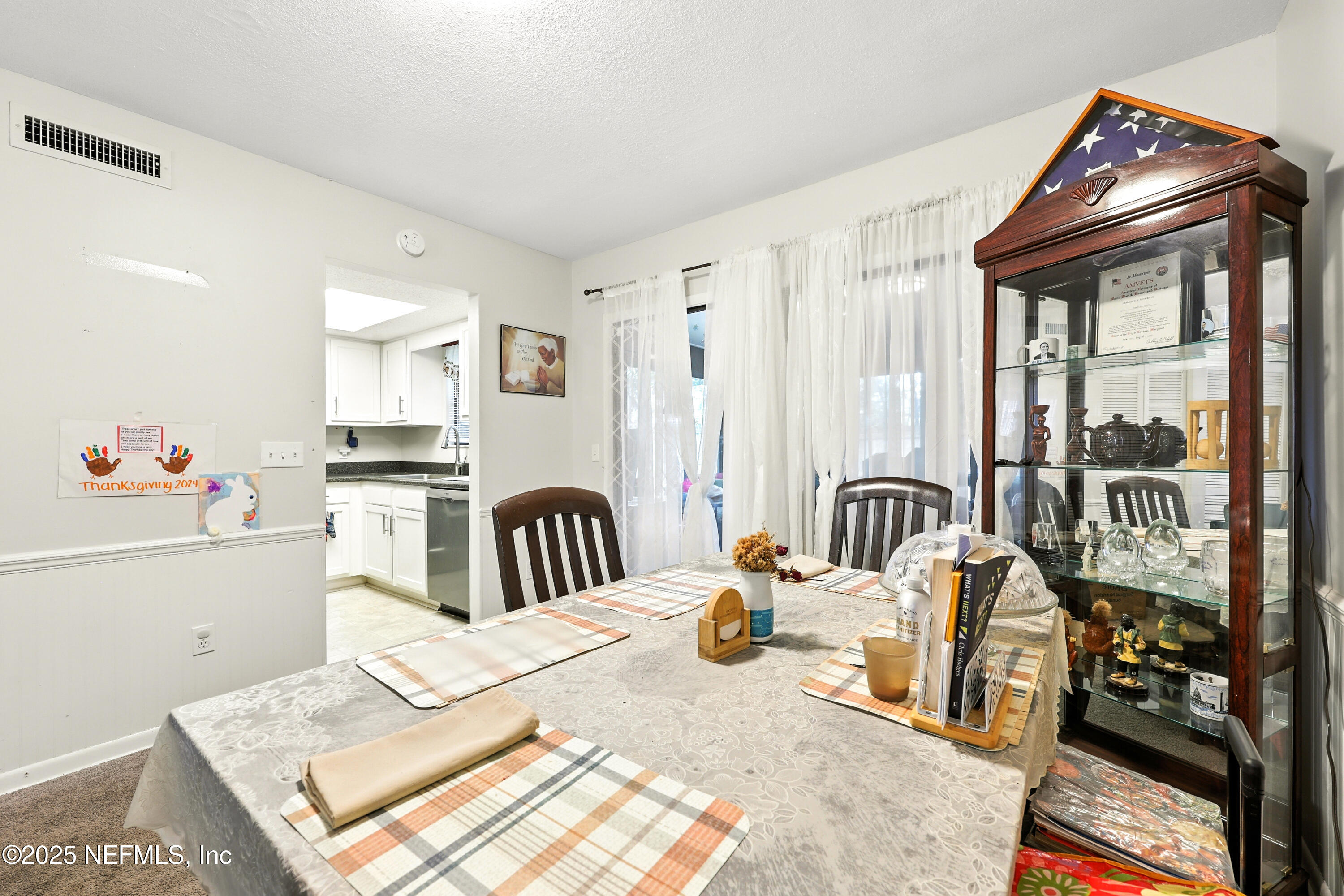 504 Kettering Way Orange Park, FL 32073 - Photo 7 of 27 a view of a kitchen with dining table and workspace