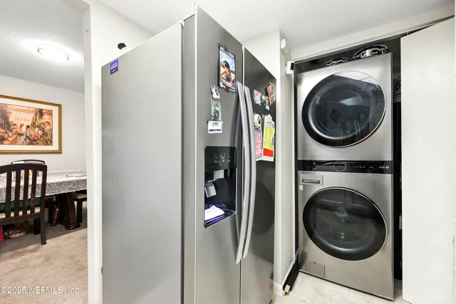 a view of a hallway with washer and dryer