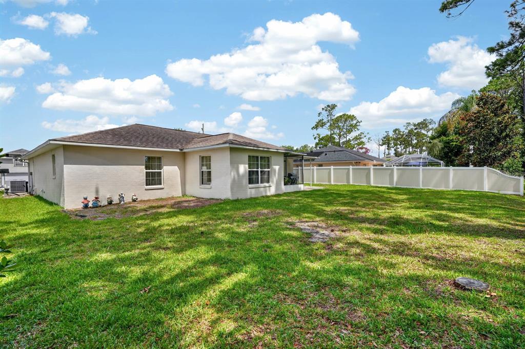 80 Roxboro Drive Palm Coast, FL 32164 - Photo 5 of 39 a view of a house with a backyard