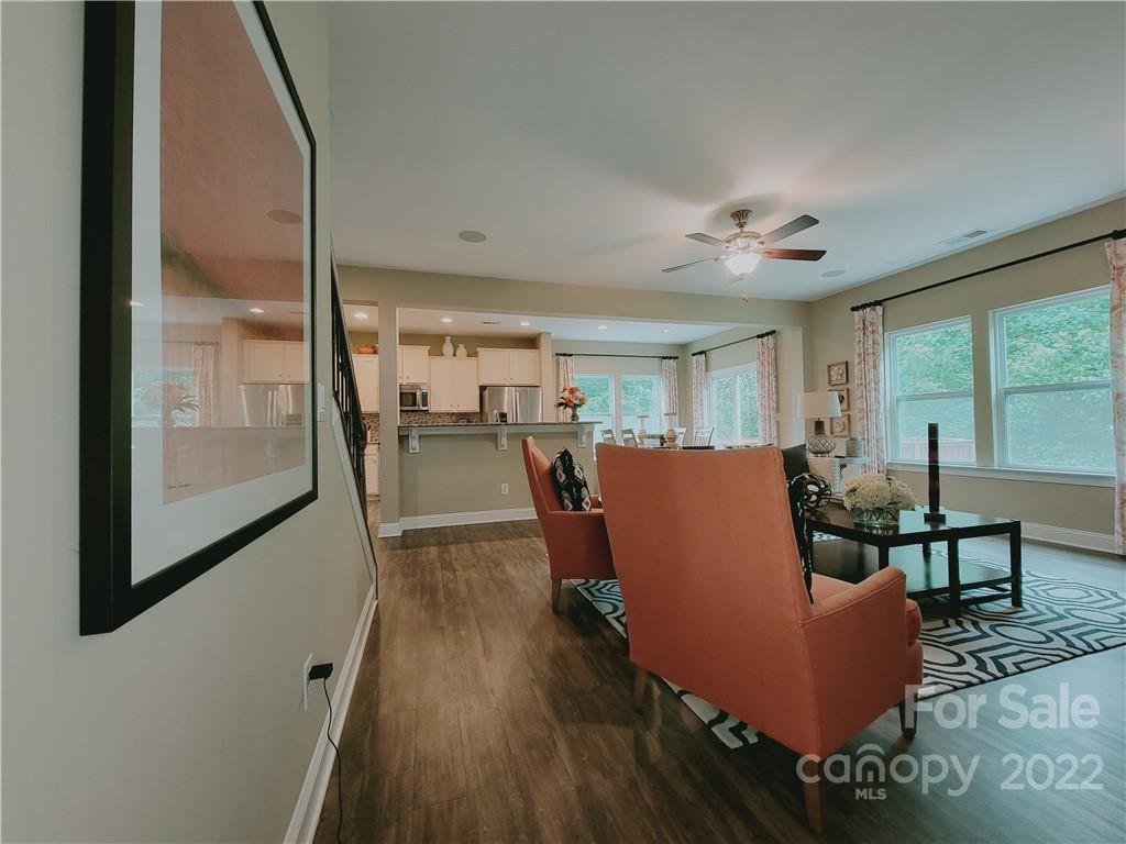 7716 West Berkeley Road Denver, NC 28037 - Photo 9 of 33 a dining room with furniture and wooden floor