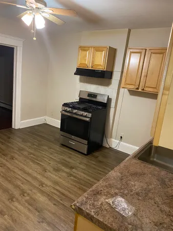 a living room with a fireplace furniture and a flat screen tv
