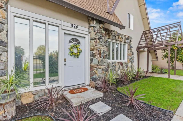 a backyard of a house with outdoor seating