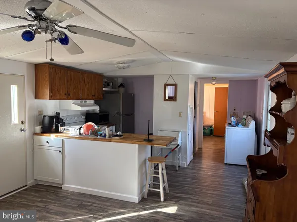 a room with furniture and wooden floor