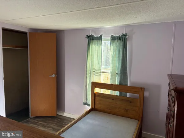 a view of room with window and front door