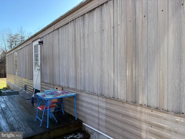 a view of a backyard with furniture